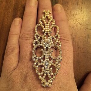 Elegant gold Tone ring with faux pearls.